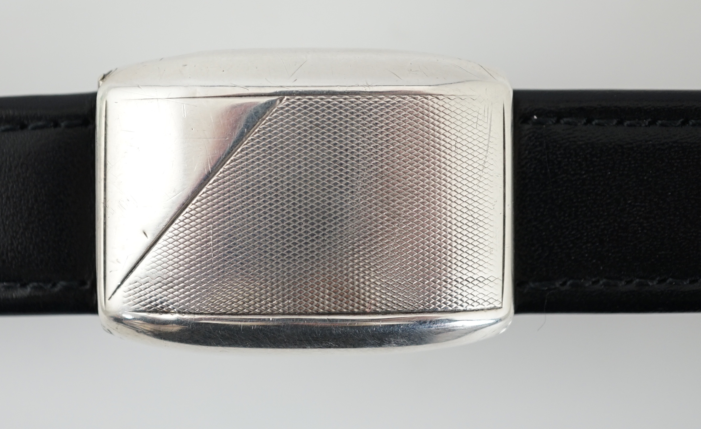 A gentleman's late 1920's silver flip action manual wind rectangular wrist watch